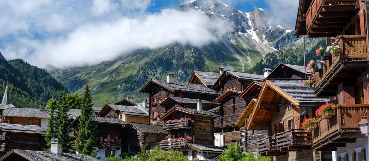 Traditional timber chalets of a settled Alpine village in the Valais.